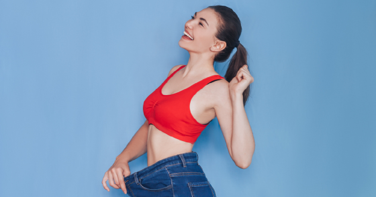 Happy woman showing weight loss results after CoolSculpting at Elite in Union, KY.